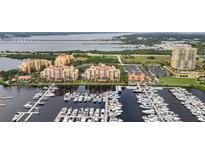 Aerial view of luxury waterfront condos with marina at 606 Riviera Dunes Way # 303, Palmetto, FL 34221