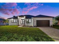 Single story home with modern design and two car garage at 45 Bunker Ln, Rotonda West, FL 33947