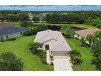 Single story home on a corner lot with mature landscaping at 12271 Lavender Loop, Bradenton, FL 34212