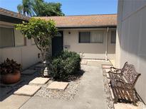 Inviting courtyard with a stone pathway and a bench at 1111 Longfellow Rd # 1111, Sarasota, FL 34243