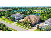 Luxury home with lake views in a gated community at 7546 Divot Loop, Lakewood Ranch, FL 34202