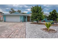 Charming single-Gathering home with a well-maintained front yard and paver driveway at 6401 36Th W Ave, Bradenton, FL 34209
