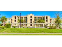 Condo building with covered parking and landscaping at 7005 River Hammock Dr # 404, Bradenton, FL 34212