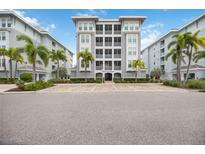 Exterior view of a building with parking area at 383 Aruba Cir # 101, Bradenton, FL 34209