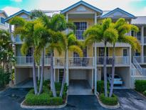 Two-story condo building with covered parking and balconies at 553 Bahia Beach Blvd, Ruskin, FL 33570
