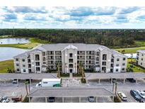 Modern apartment building with covered parking and landscaping at 18114 Gawthrop Dr # 403, Bradenton, FL 34211