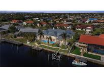 Waterfront home features a screened pool, dock, and direct canal access for boating and enjoying waterfront living at 239 Fry Se Ter, Port Charlotte, FL 33952