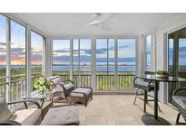 Comfortable lanai featuring tile flooring, ceiling fan, and panoramic views of the bay at 236 Hidden Bay Dr # 301, Osprey, FL 34229