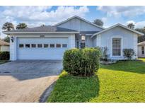 Charming one-story home with a two-car garage and well-maintained lawn at 6933 43Rd E Ct, Sarasota, FL 34243