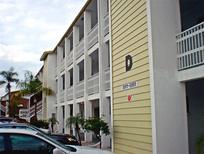 View of the building's exterior, showing its architectural style at 5925 Todd St # D-21, Bradenton, FL 34207