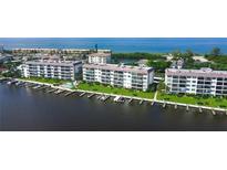 Aerial view of waterfront condos with boat slips at 8911 Midnight Pass Rd # 110, Sarasota, FL 34242