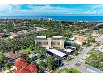 Aerial view of a coastal community, showing building and ocean at 512 W Venice Ave # 403, Venice, FL 34285