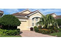Charming villa with lush landscaping, paved driveway and an attached garage at 7818 33Rd E St, Sarasota, FL 34243