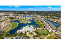 Aerial view of community with clubhouse, pool, and golf course at 1817 Birmingham Blvd, Punta Gorda, FL 33980