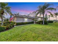 House exterior at dusk with landscaping at 5092 Mahogany Run Ave, Sarasota, FL 34241