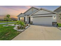 Two story home with a landscaped front yard at 5120 Vecchio Ct, Bradenton, FL 34211