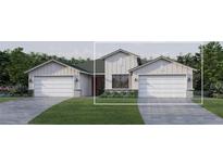 Two-story house with gray siding, two-car garage, and a stone facade at 18839 Dayspring Pl, Venice, FL 34293