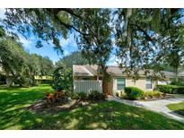 Well-maintained home with lush landscaping and walkway at 3447 Tallywood Ln # 7143, Sarasota, FL 34237