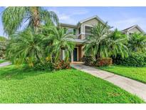 Beautiful two-story home with lush landscaping at 8905 Manor Loop # 205, Lakewood Ranch, FL 34202