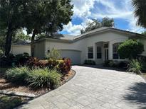 Luxury home with circular driveway and landscaping at 5658 Downham Meadows, Sarasota, FL 34235