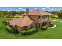 Two-story house with pool and large grassy yard at 7301 221St E St, Bradenton, FL 34211
