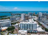 Aerial view of a modern highrise building near the water at 111 S Pineapple Ave # 605, Sarasota, FL 34236