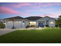 Charming single-story home with landscaped yard and basketball hoop at 5819 2Nd Avenue Nw Dr, Bradenton, FL 34209