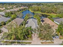Aerial view of single-Gathering home with lake access in a quiet community at 12121 Thornhill Ct, Lakewood Ranch, FL 34202