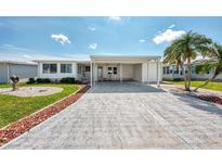 Single-story home with carport and landscaped yard at 634 Schooner St, North Port, FL 34287