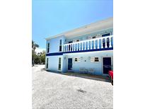 Two-story light blue building with balconies at 2850 Gulf Of Mexico Dr # 2, Longboat Key, FL 34228