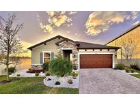 Charming single-story home with stone accents at 12661 Oak Hill Way, Parrish, FL 34219