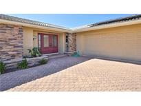 Front view of house with stone accents and double door entry at 7207 13Th W Ave, Bradenton, FL 34209