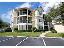 Three-story building with balconies and landscaping at 5122 Northridge Rd # 207, Sarasota, FL 34238