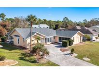 Single-Gathering home with a large yard and screened pool at 2837 Cabaret St, Port Charlotte, FL 33948