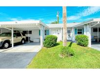 Single story home with carport and well manicured landscaping at 6041 Lilli Way # 72, Bradenton, FL 34207