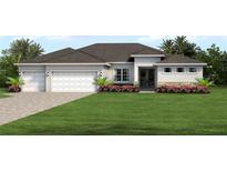 Two-car garage home with attractive landscaping at 27059 Curitiba Dr, Punta Gorda, FL 33983