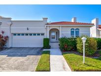 Villa with attached garage and walkway at 4818 61St Avenue W Ter, Bradenton, FL 34210