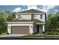 Two-story home with a brown garage door and light beige exterior at 15165 Shady Palms Ln, Nokomis, FL 34275