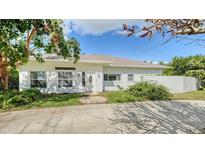 White house exterior with landscaping and a paved driveway at 1789 Loma Linda St, Sarasota, FL 34239