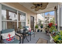 Relaxing screened balcony with seating, plants, and view of trees at 4802 51St W St # 1010, Bradenton, FL 34210