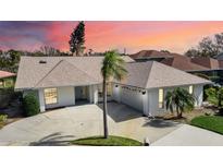 Single-story home with a large yard and attached garage at 2303 89Th Nw St, Bradenton, FL 34209
