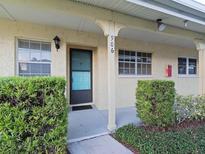 Condo building exterior with teal front door at 2465 Northside Dr # 906, Clearwater, FL 33761