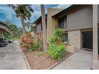 Condo building exterior with landscaping and walkway at 947 Sunridge Way # A-3, Sarasota, FL 34234