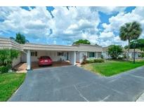 Cute and cozy condo with carport parking and well-maintained landscaping at 2609 Riverbluff Pkwy # 146, Sarasota, FL 34231