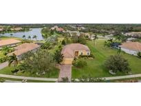 Inviting single-story home with lush green lawn and mature landscaping in a desirable neighborhood at 409 147Th Ne Ct, Bradenton, FL 34212