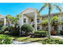 Two-story building with lush landscaping at 9489 Millbank Dr # 2625, Sarasota, FL 34238