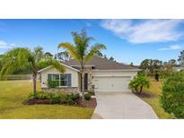 One-story house with a stone facade, two-car garage, and palm trees at 13707 Woodbridge Ter, Bradenton, FL 34211