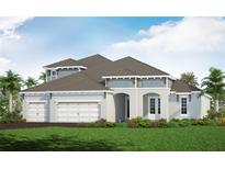 Two-story home with three car garage and landscaped yard at 8124 Anthirium Loop, Sarasota, FL 34240