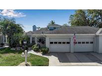 Two-story house with a two-car garage and walkway at 6581 Approach Rd # 63, Sarasota, FL 34238