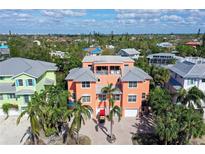 Large two-story home with a gray metal roof and two car garage at 467 Canal Rd # 467, Sarasota, FL 34242